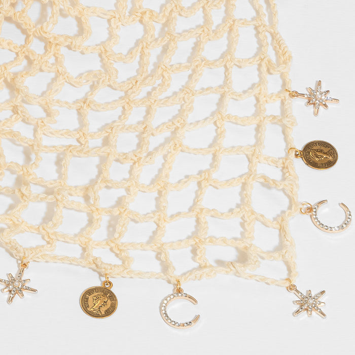 Lightweight bohemian crochet wrap in warm off-white - perfect for travel, concerts, and everyday styling