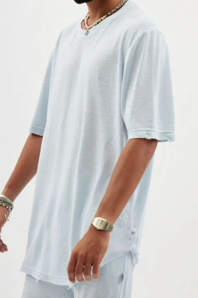 TFU Soft Essential Tee in sky blue, worn by a person with beaded necklaces and a watch