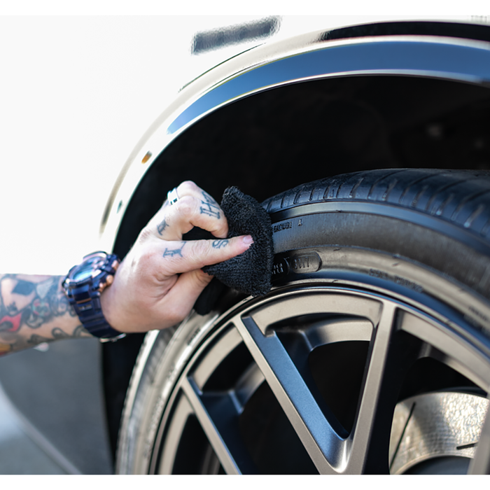 P&S Shine All Performance Dressing 16oz and applicator cleaning a tire.