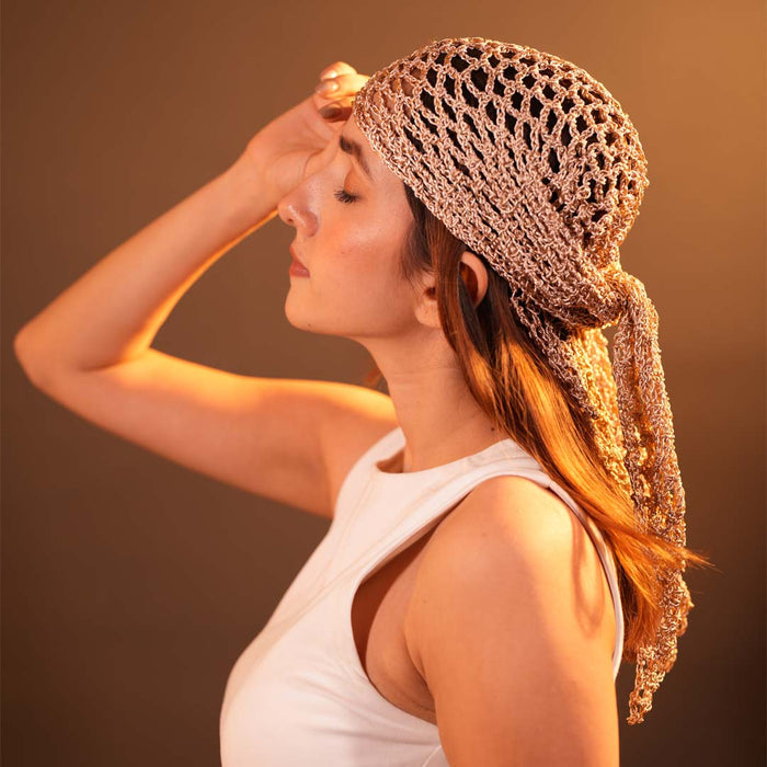 Bohemian crochet headscarf in dull gold metallic thread styled as a versatile hair scarf or bandana