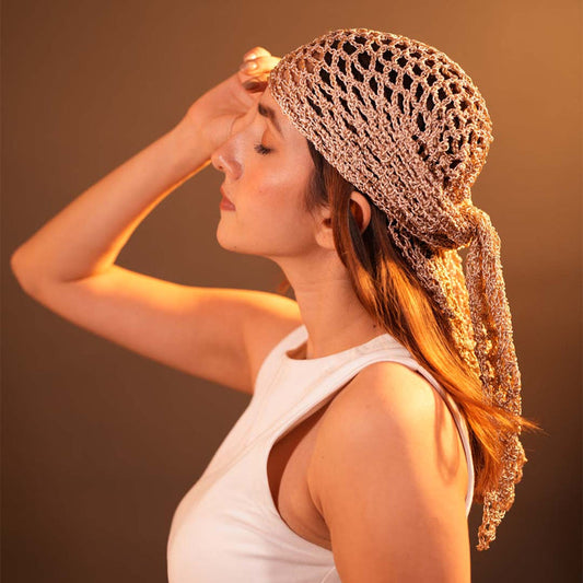 Bohemian crochet headscarf in dull gold metallic thread styled as a versatile hair scarf or bandana