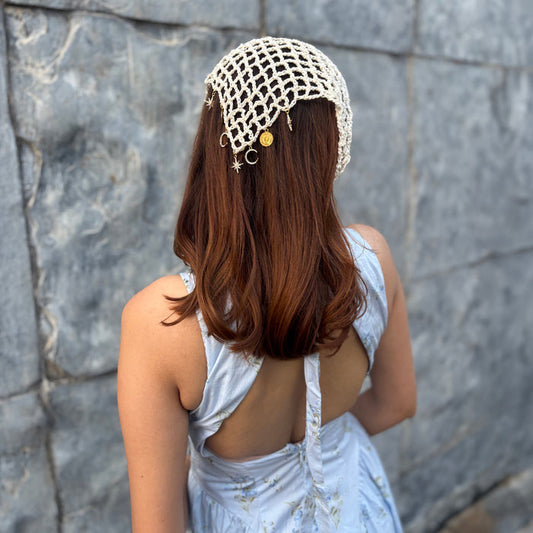 Off white crochet headscarf with gold star and moon charms, ties as bandana or hair wrap