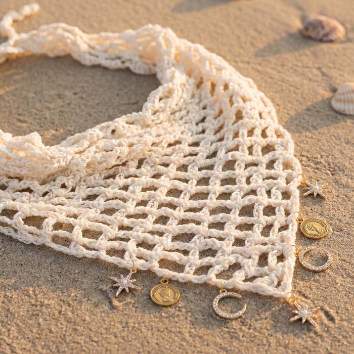Off-white hair wrap with star and moon charms dangling, boho crochet headscarf for beach days