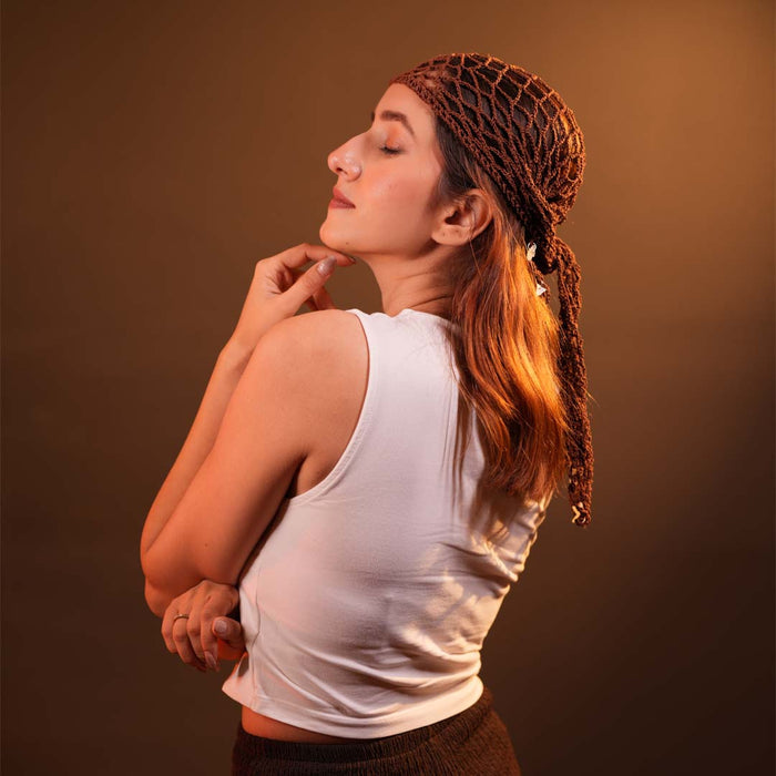 Lightweight brown crochet scarf with shells styled as head wrap for effortless summer look