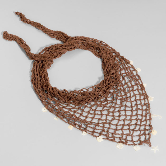 Coastal brown crochet headscarf featuring shell accents, tied as relaxed boho hair wrap