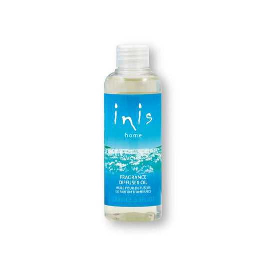Bottle of inis home fragrance diffuser oil with a blue label on a white background