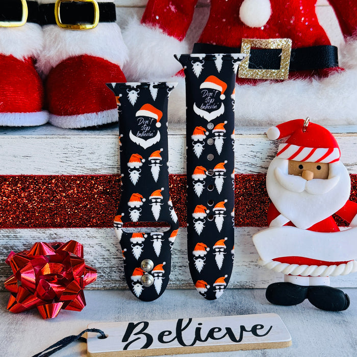 Don't Stop Believin' Apple Watch band with Santa beards and red hats on black background with Christmas decorations
