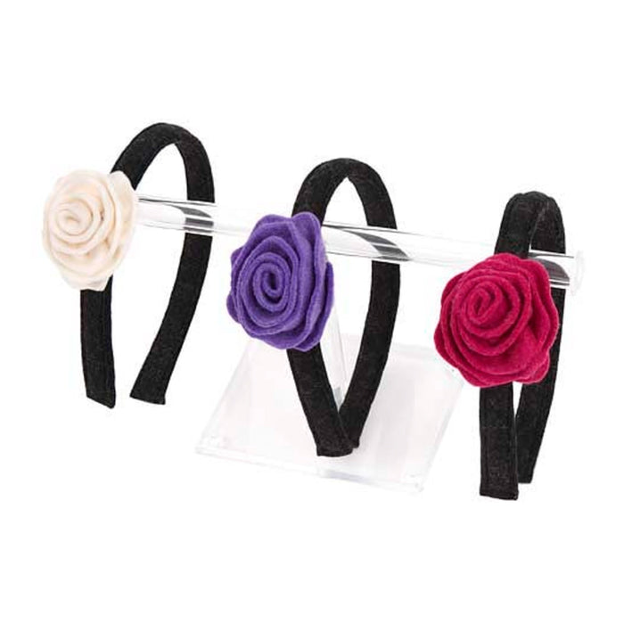 Set of three black headbands with felt flowers, purple, pink and white on a white background.