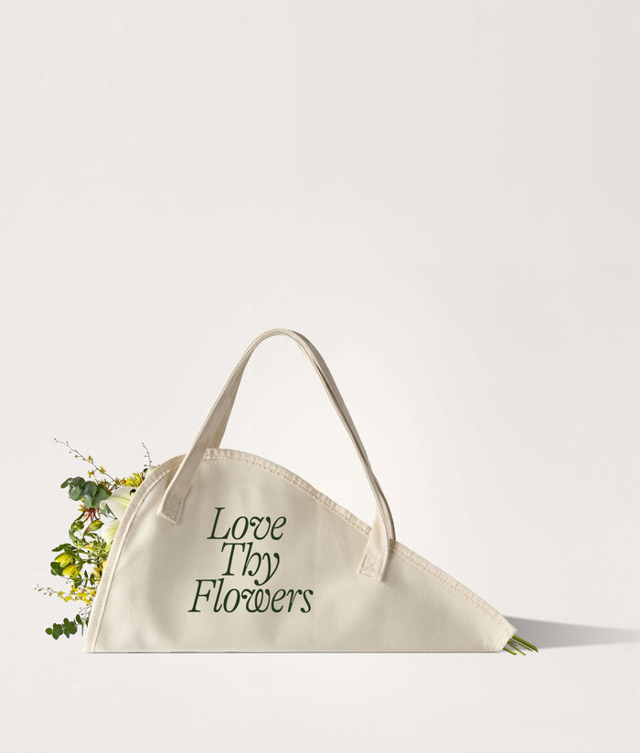 Flower Tote Love Thy Flowers Large. Beige flower tote bag with 'Love Thy Flowers' text on a white background.