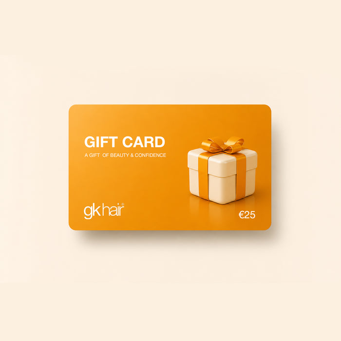 GK Hair Gift Card in orange, printed GIFT CARD, A GIFT OF BEAUTY & CONFIDENCE and €25, with a cream gift box and gold bow
