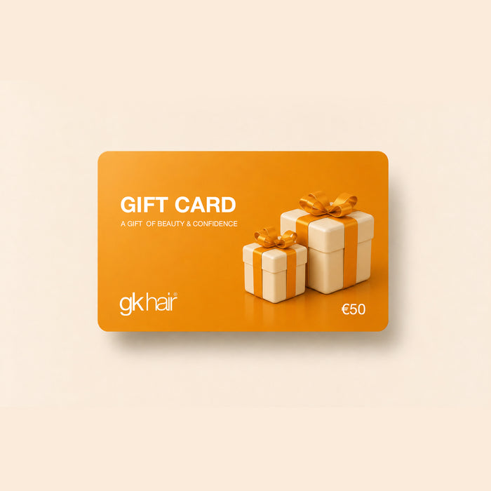 GK Hair Gift Card in orange, printed GIFT CARD, A GIFT OF BEAUTY & CONFIDENCE and €50, with two cream gift boxes and gold bows