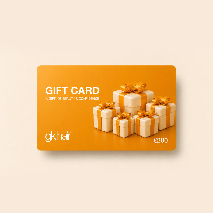 GK Hair €200 gift card in orange, Gift Card and a gift of beauty & confidence above five ribboned cream gift boxes