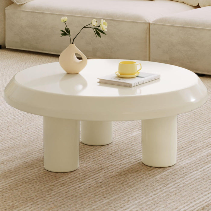 Circular cream white coffee table with durable construction and modern design.