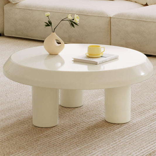 Circular cream white coffee table with durable construction and modern design.