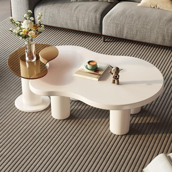A versatile set of two nesting tables, including a cloud-shaped coffee table and an irregular-shaped side table.