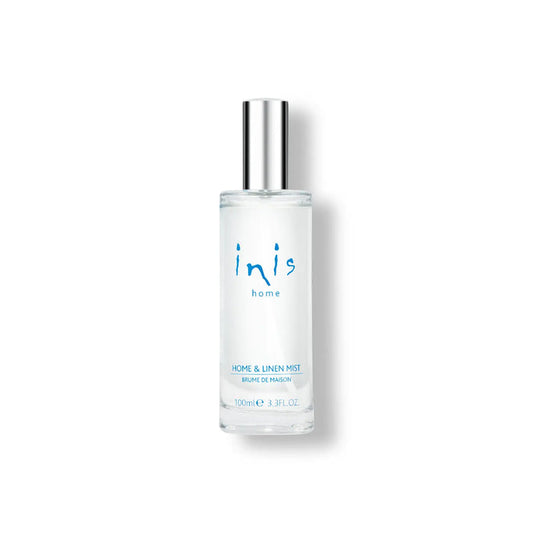 Clear glass bottle with silver cap labeled 'inis' on a white background