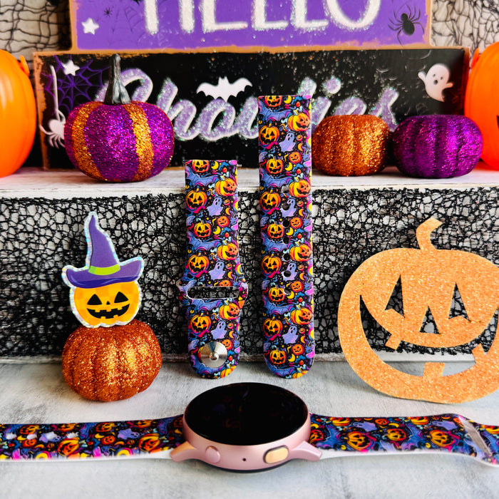 Jack-O-Lantern Jive silicone Samsung Galaxy Watch band hero shot in purple with glowing orange pumpkins, shown with a rose gold Galaxy Watch.