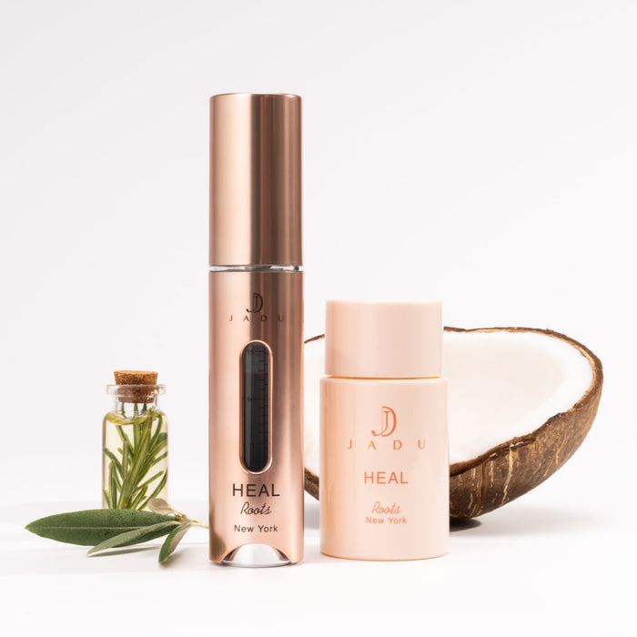 Jadu Heal rosemary leaf oil vial and coconut halves