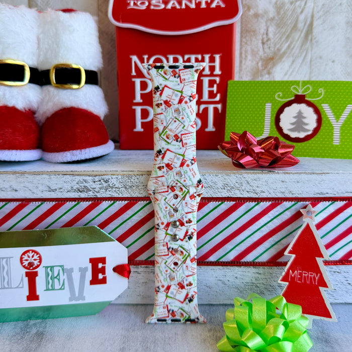 Close-up of Letters to Santa Christmas envelope print pattern on Apple Watch silicone band showing candy canes and stamps