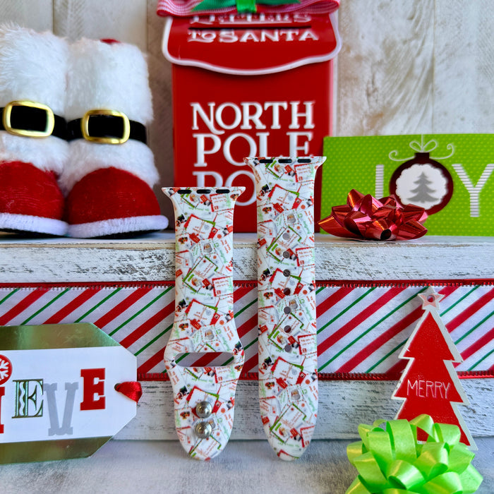 Close-up of Letters to Santa Christmas envelope print pattern on Apple Watch silicone band showing candy canes and stamps