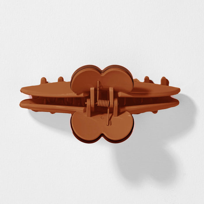 Durable brown claw clip with charming heart design for effortless everyday hairstyles