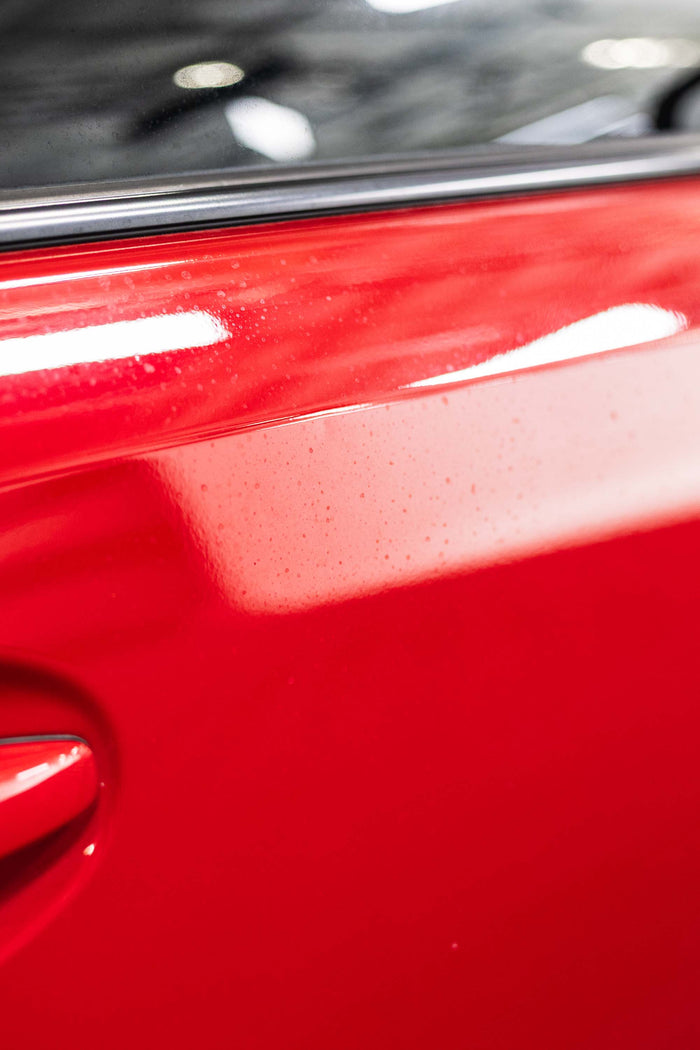 Opti-Coat MDR on a red car door.