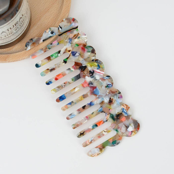 Multicolor acetate wide-tooth hair comb with smooth curved teeth for detangling straight, wavy, and curly hair.