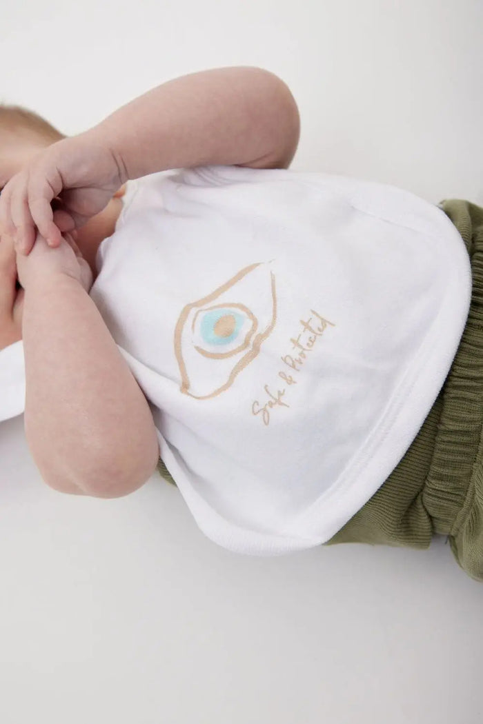Newborn Cotton Bib with a graphic of an eye and the words Safe & Protected