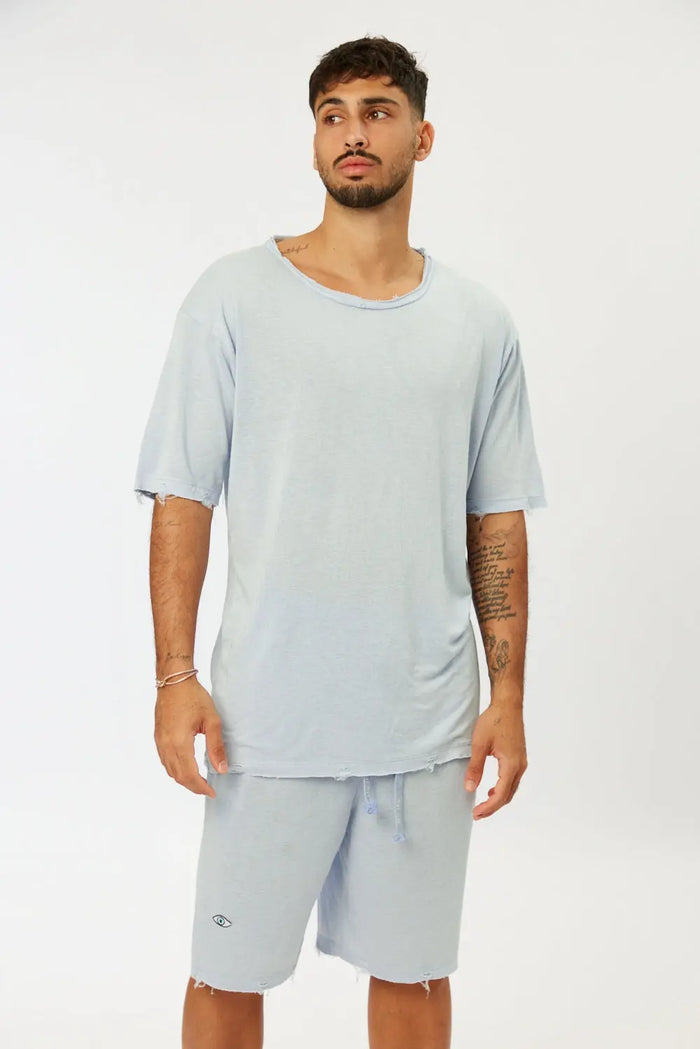 Nicki Soft Open Top in light blue on a male model, paired with matching shorts
