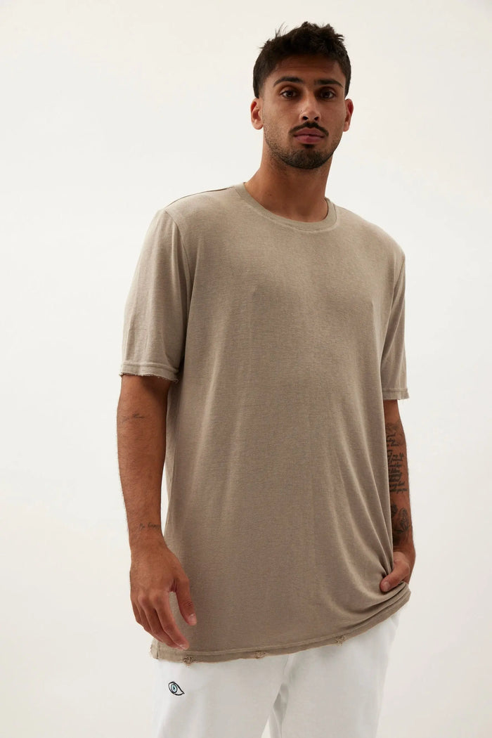 Nicki Soft Open Top in light olive green on a male model with a hand in his pocket