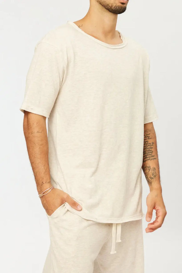 Nicki Soft Open Top in melange stone, worn by a person with a hand in their pocket