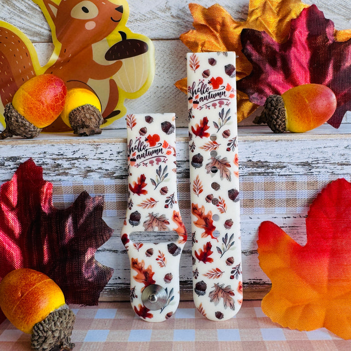 Nutty For Fall Samsung Galaxy Watch band with both strap halves side by side, styled with faux maple leaves, acorns, and a squirrel cutout on plaid.
