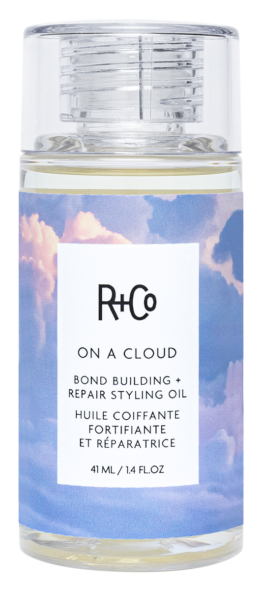 R+Co styling oil bottle with cloud design on label