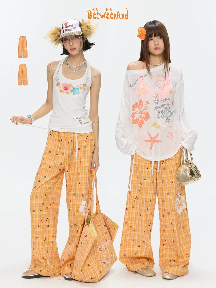 Orange checkered stars print pants
