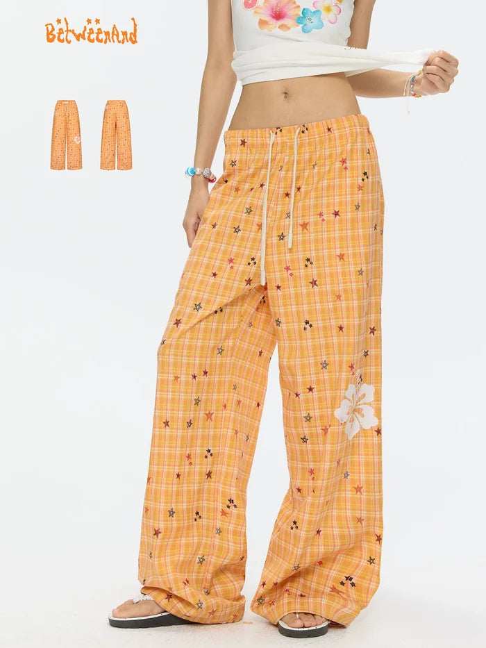 Orange checkered stars print pants