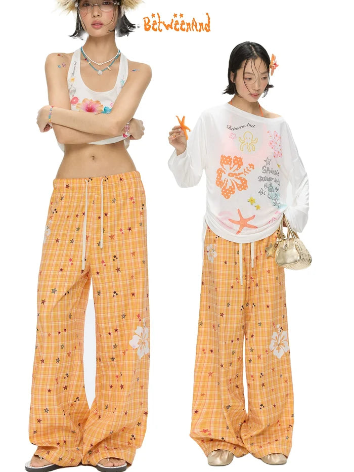 Orange checkered stars print pants