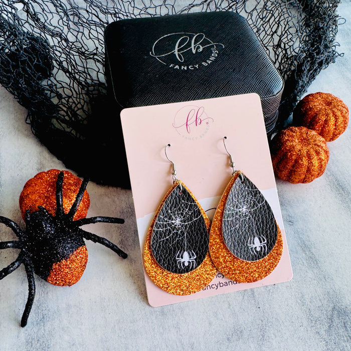 Orange Webbed Sparkle Double Layer Faux Leather Drop Ear Bling — Introducing our double-layer tear drop faux leather earrings, where sophistication meets creativity.