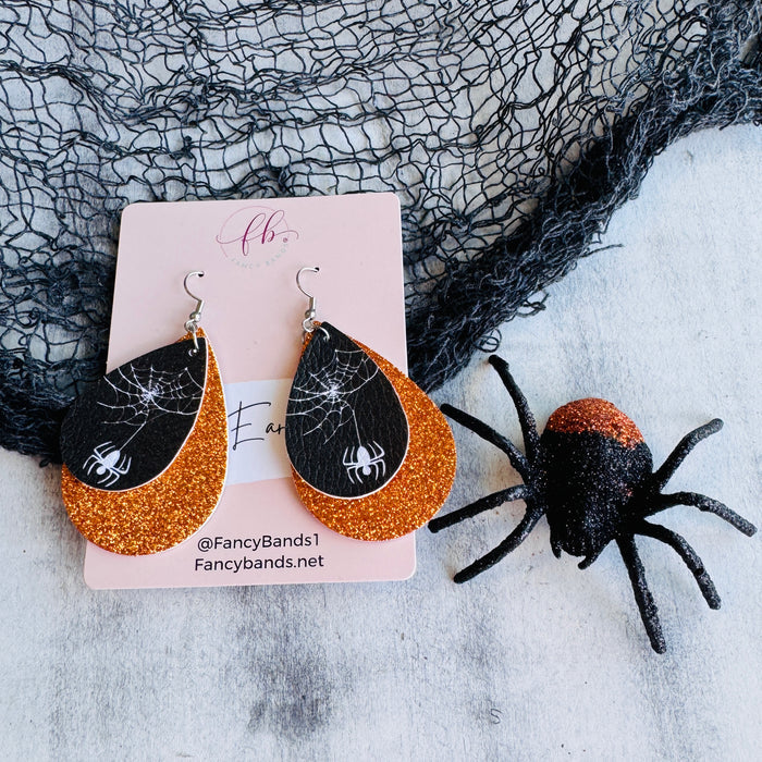 Orange Webbed Sparkle Double Layer Faux Leather Drop Ear Bling — Introducing our double-layer tear drop faux leather earrings, where sophistication meets creativity.