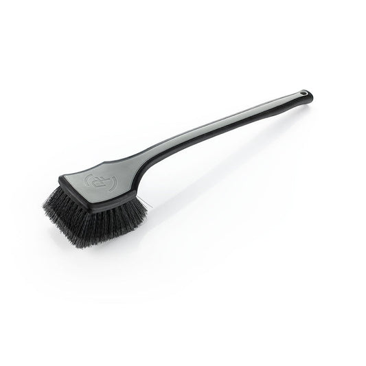 A grey Detail Factory fender well brush on a white background.