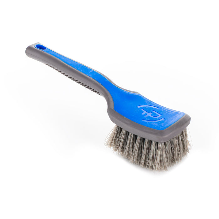 Detail Factory Tire Scrub Brush Avalanche handle view on a white background.