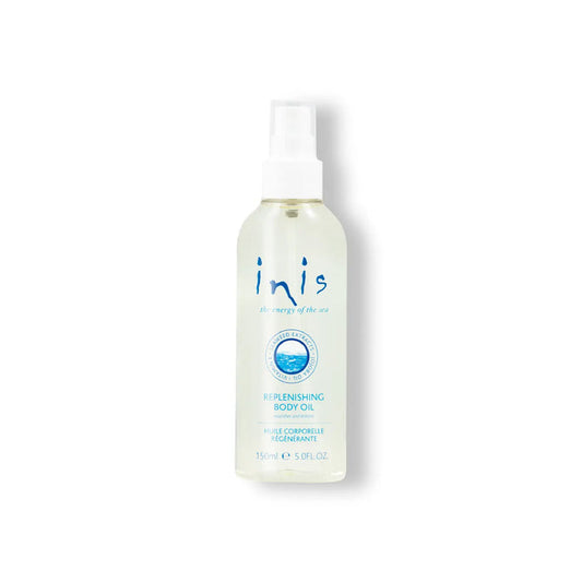 Bottle of Inis body oil on a white background