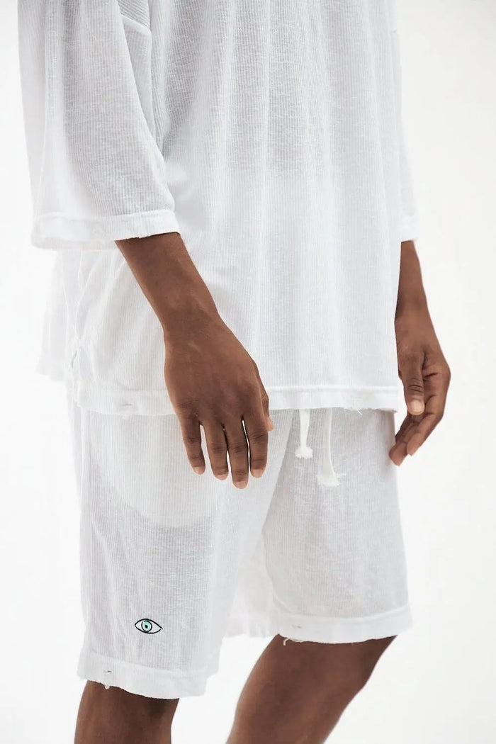 Rib Bermuda Shorts in white with a small eye logo on the left leg