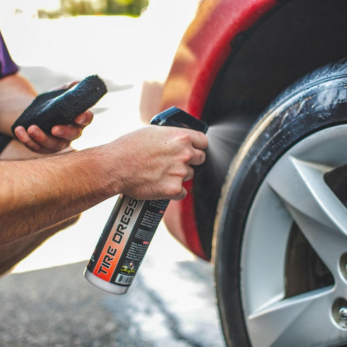 P&S Shine All Performance Dressing 16oz and applicator demo spraying on car tire.