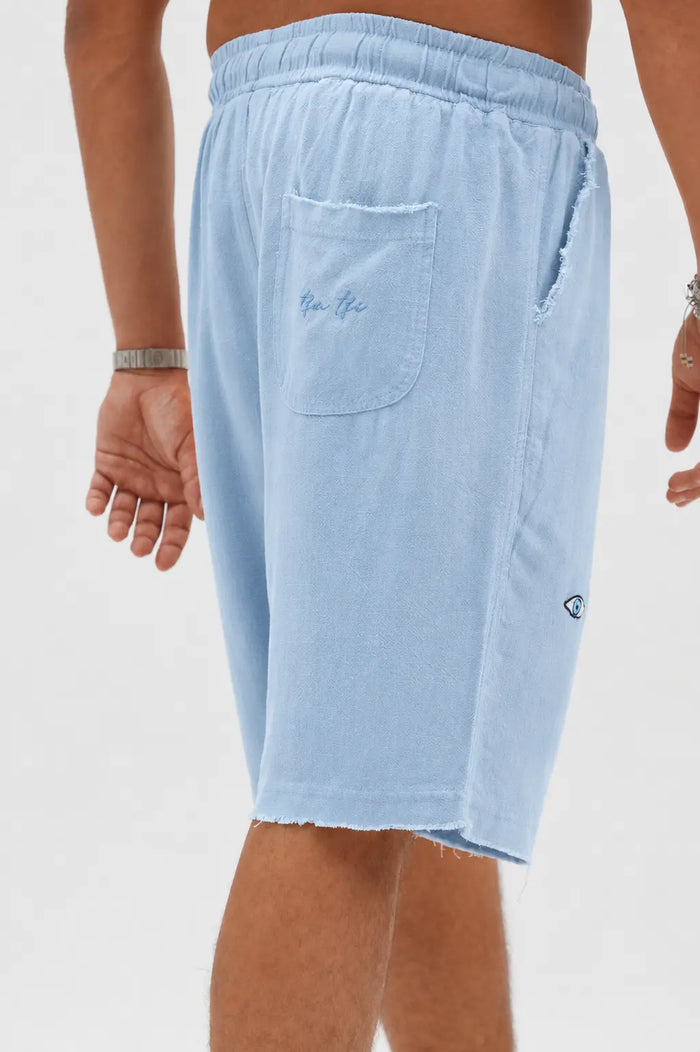 Soft Linen Bermuda Shorts in Sky Blue, with a back pocket and a small eye logo on the side