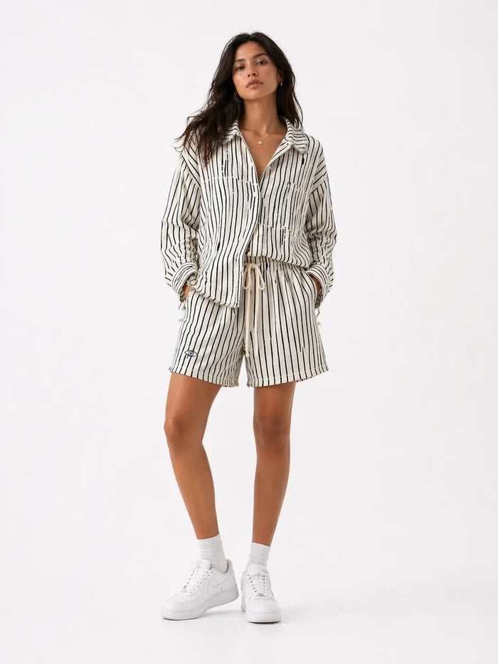 Woman wearing Soft linen shorts - Black Stripes with matching button-up shirt