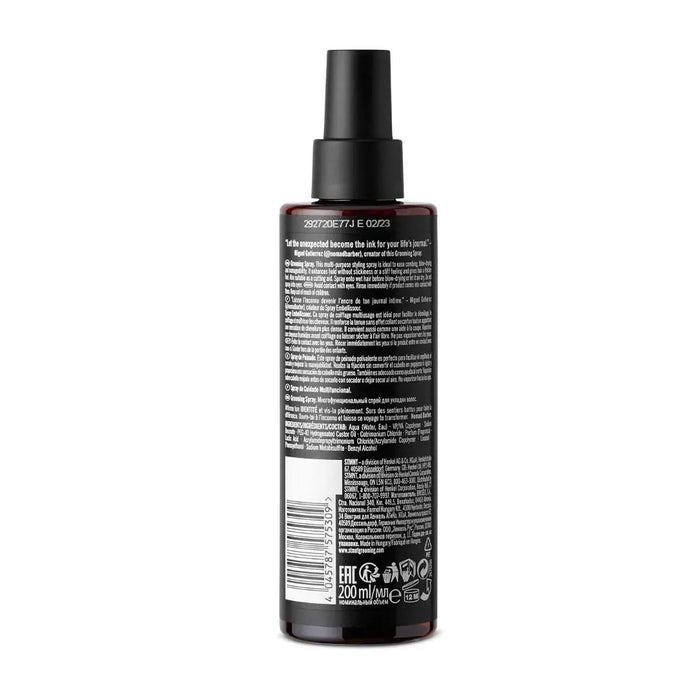 STMNT  Back view of a black spray bottle with text on a white background