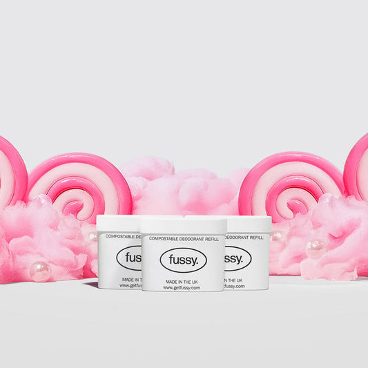 Fussy's Sugar Crush Deodorant Refill Packs featuring three refill packs set against a backdrop of cotton candy and pink and white lollipops