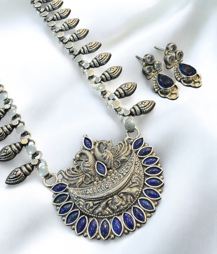 The Abhishti Nakshi Silver Blue Peacock Necklace & Earrings