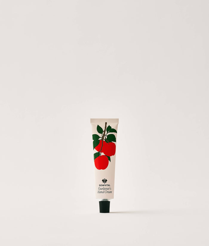 Apple Orchard Hand Cream 20ml. Hand cream tube with apple design on a white background