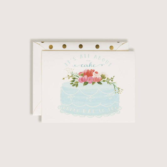 Card with a cake illustration and floral design on a white background